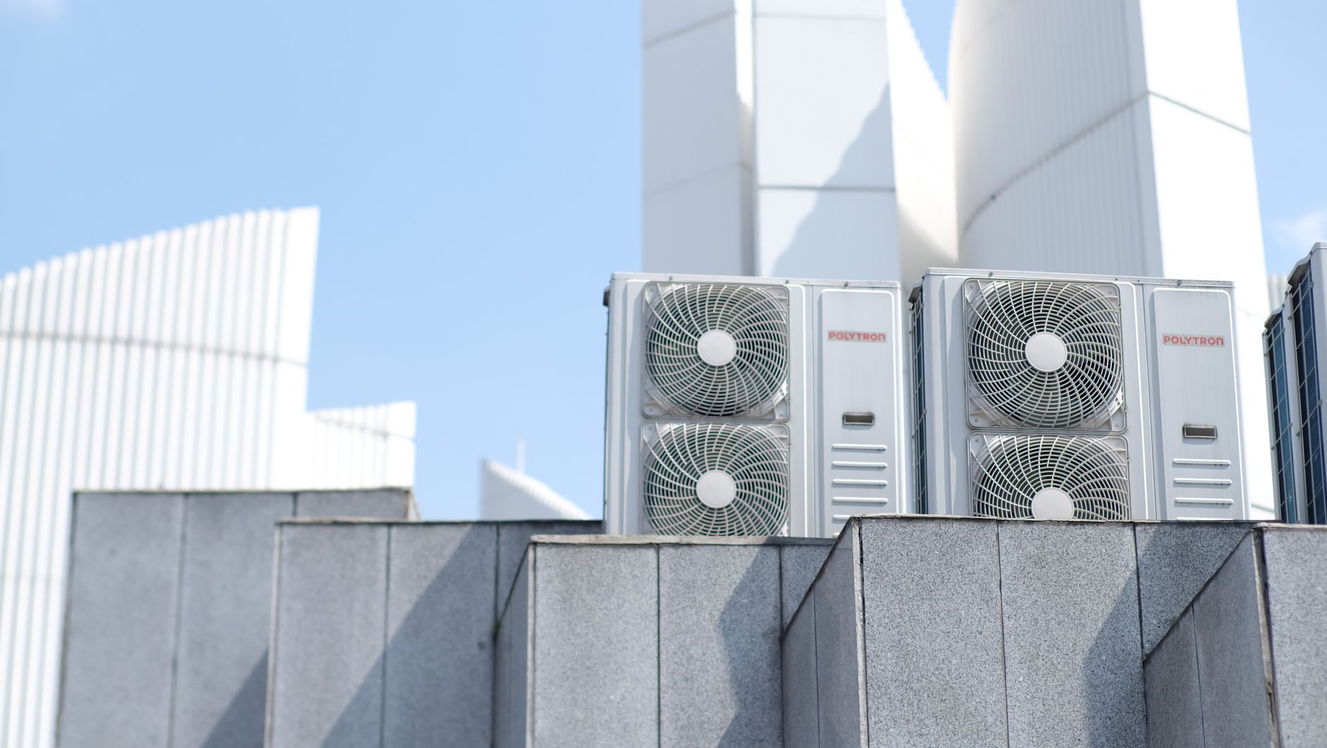 modern air conditioner units on urban rooftop